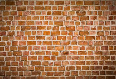 background and texture of decorative red brick wall pattern with cement in horizontal viewの写真素材