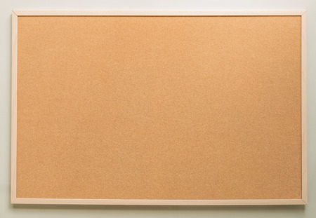 rectangle brown cork board on white wall backgroundの写真素材