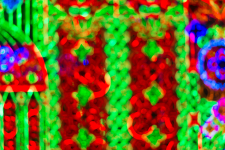 Abstract circular light bokeh New Year Festive background of defocused decorated xmas tree bokeh...