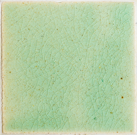 close up background and texture of stretch marks cracked on emerald green glazed tile