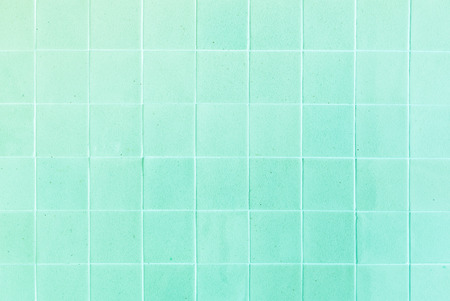 close up background and texture of stretch marks cracked on green glazed tileの写真素材