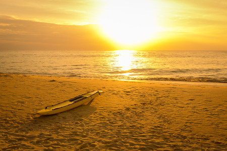 Surfboard on the sand beach in sunset at phuket Thailandの写真素材