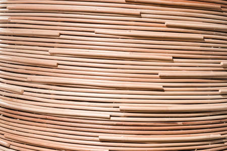 traditional thai style pattern nature background of brown handicraft weave texture rattan surface for furniture materialの写真素材