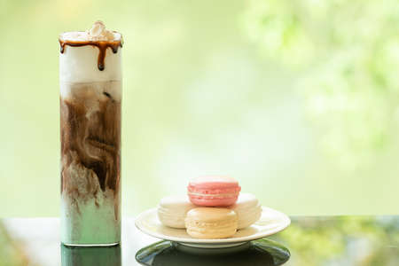 Close up of delicious juicy fresh chocolate mint on glass table Blurred leaf reflection background