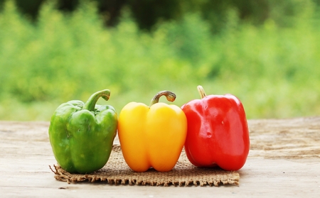 yellow and red and green pepper on white.