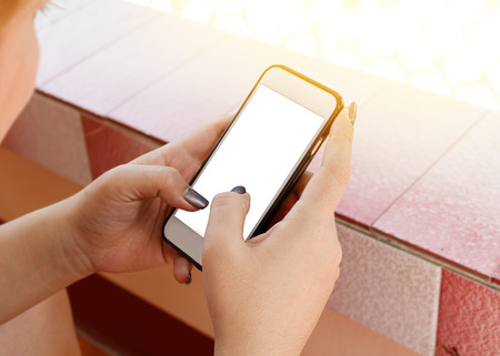 woman uses his Mobile Phone outdoor, close upの写真素材