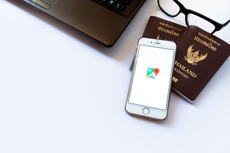 LAMPHUN, THAILAND - JULY 22, 2016:Google street view app on iphone6, that provides panoramic views from positions along many streets in the world and Thailand passport, soft focusのeditorial素材