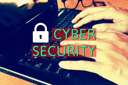 Close up woman working at home office,fingers using touch texting on a computer laptop keyboard, Cyber security concept.の写真素材