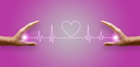 Heart rate line and the hand glow up.の写真素材