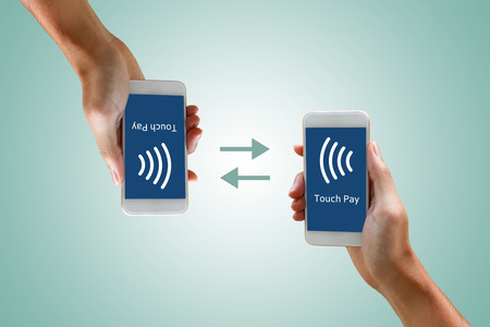 Mobile payments with smartphone concept. Woman holding phone and paying by touch.