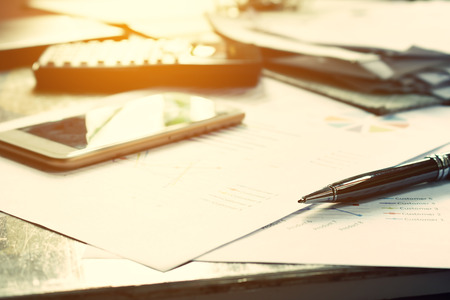 Close up business concept, Pen on summary report and calculator on table office.の写真素材