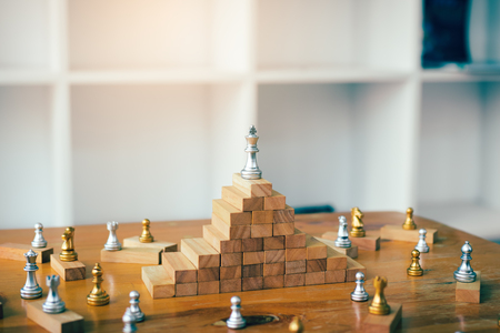 Leadership concept with king chess on top wooden block.の写真素材