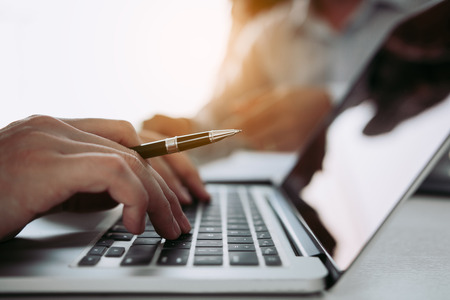 Managers are using fingers to typing personal information of employees who apply for jobs on the computer.の写真素材