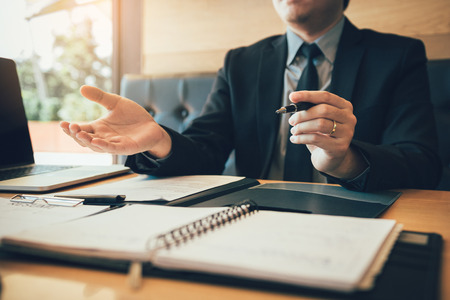 Interviewer is sitting to explain about the work of the new employee.の写真素材