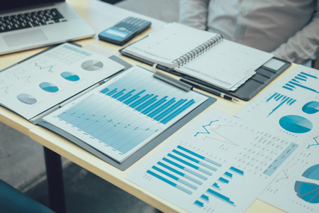 Many business documents on the deskの写真素材