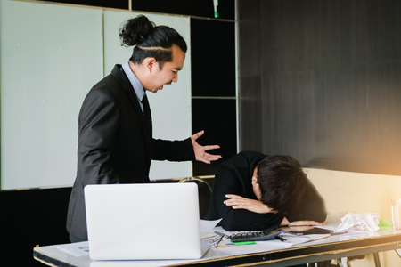 Boss shouting to employee while mistake working.の写真素材