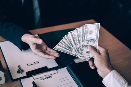 New homeowner handed the money and real estate trading concepts.の写真素材