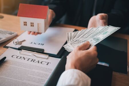 New homeowner handed the money and real estate trading concepts.の写真素材
