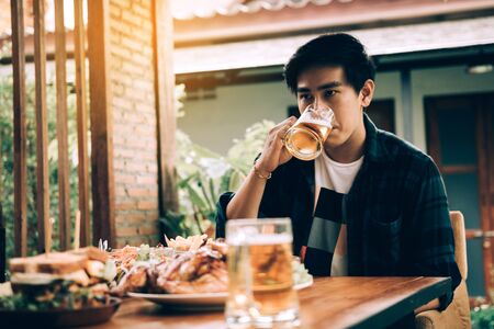 Guys drinking in a lonely night.の写真素材