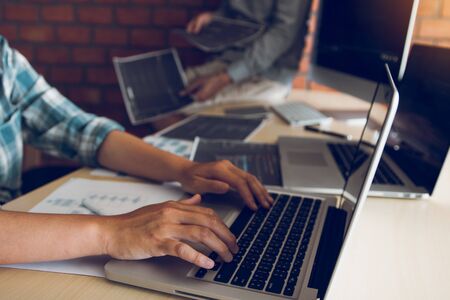 Two software developers are analyzing together about the code written into the program on the...
