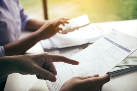 Two asian couples and men and women are together analyzing expenses or finances in deposit accounts and daily income sources with an savings economical concept.の写真素材