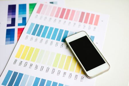 Designer equipment with smartphone on the desk.の写真素材