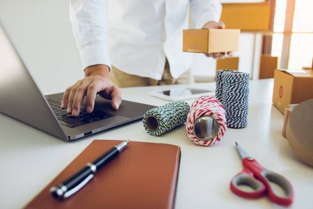 Start up small business owner entrepreneur SME, using laptop for online business in office room.の写真素材