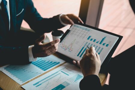 Two business partnership coworkers analysis strategy and gesturing with discussing a financial...
