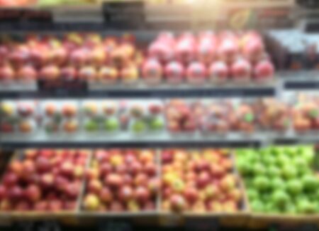 Blur background fruits and vegetables on shelves at shopping retail in supermarket.の写真素材