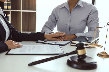 Lawyer is counseling the client in his counsel and will not escape the lawsuit.の写真素材