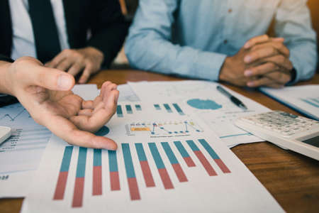 Two businessmen discussion analysis sharing calculations about the company budget and financial...