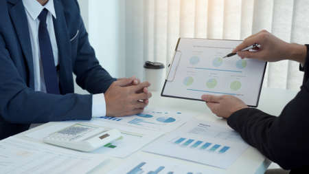 Group of business people analysis summary graph reports of business operating expenses and work data about the company's financial statements.の写真素材