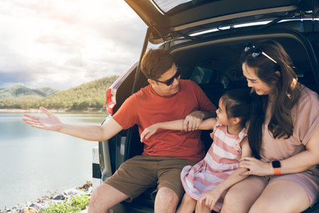 Summer vacations.Happy family enjoying trip with their favorite car. Holiday and travel family concept.の写真素材