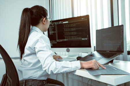 Developing programming and coding technology working in a software engineers developing applications in office.の写真素材