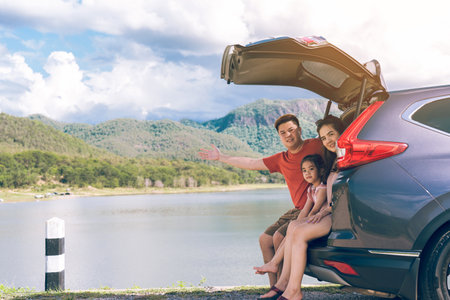 Summer vacations.Happy family enjoying trip with their favorite car. Holiday and travel family concept.の写真素材
