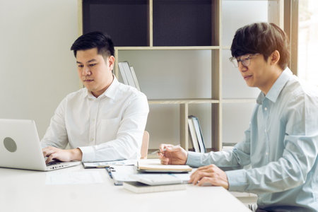 Businessmen working together in the office.の写真素材