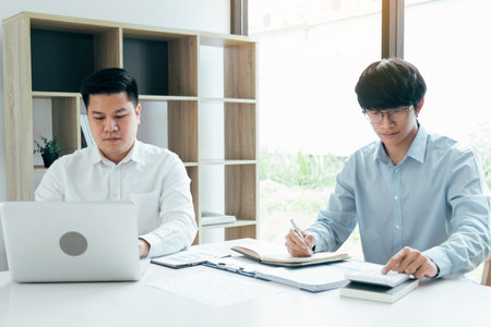 Businessmen working together in the office.の写真素材