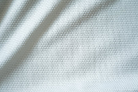 Close up of white football jersey sports clothing fabric texture.の写真素材