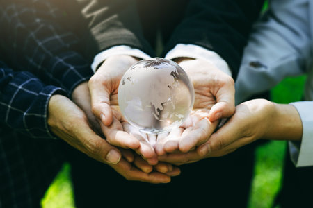 People holding earth environmentally together sustainable Save Earth. the Environment World Earth Day concept.の写真素材