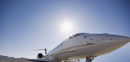 A personal jet against a blue skyの写真素材