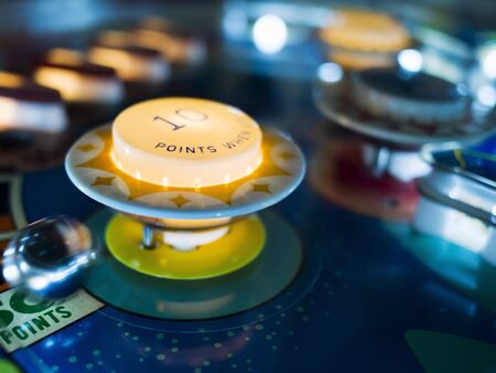 Antique Pinball Machine Bumpers with Motion Blur Ballの写真素材