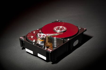 Opened and Exposed Hard Drive Platters in Red