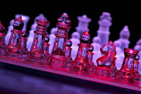 Glass Chess Board and Pieces in Red and Purpleの写真素材