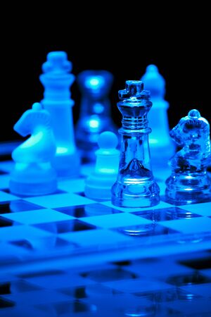 Glass Chess Board and Pieces in Blueの写真素材
