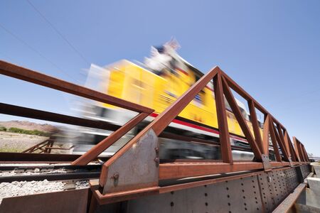 Freight train moving down the tracks with motion blurの写真素材