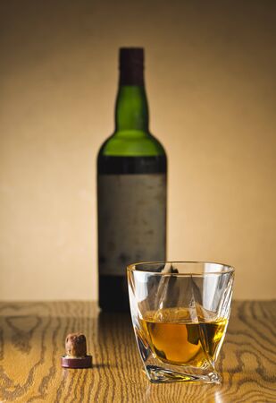 Whiskey Bottle and Cork and Crystal Tumblerの写真素材