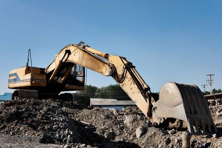 Heavy Construction Equipment Hydraulic Excavator against a cloudy sky