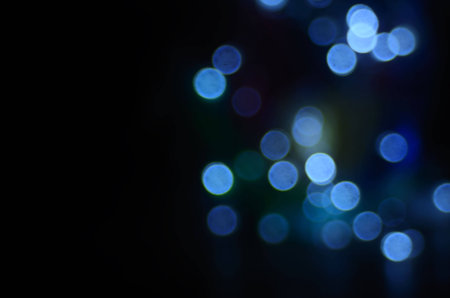blue bokeh on black backgroundの写真素材