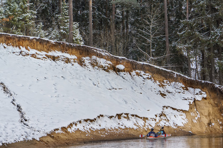 Winter adventure on a kayak.の写真素材