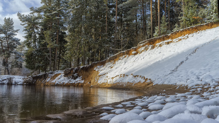 Winter snow-covered forest river.の写真素材